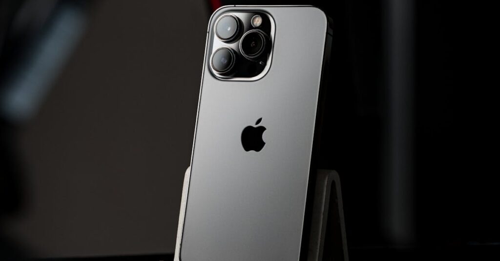 A modern smartphone displayed on a stand against a dark, minimalist background.